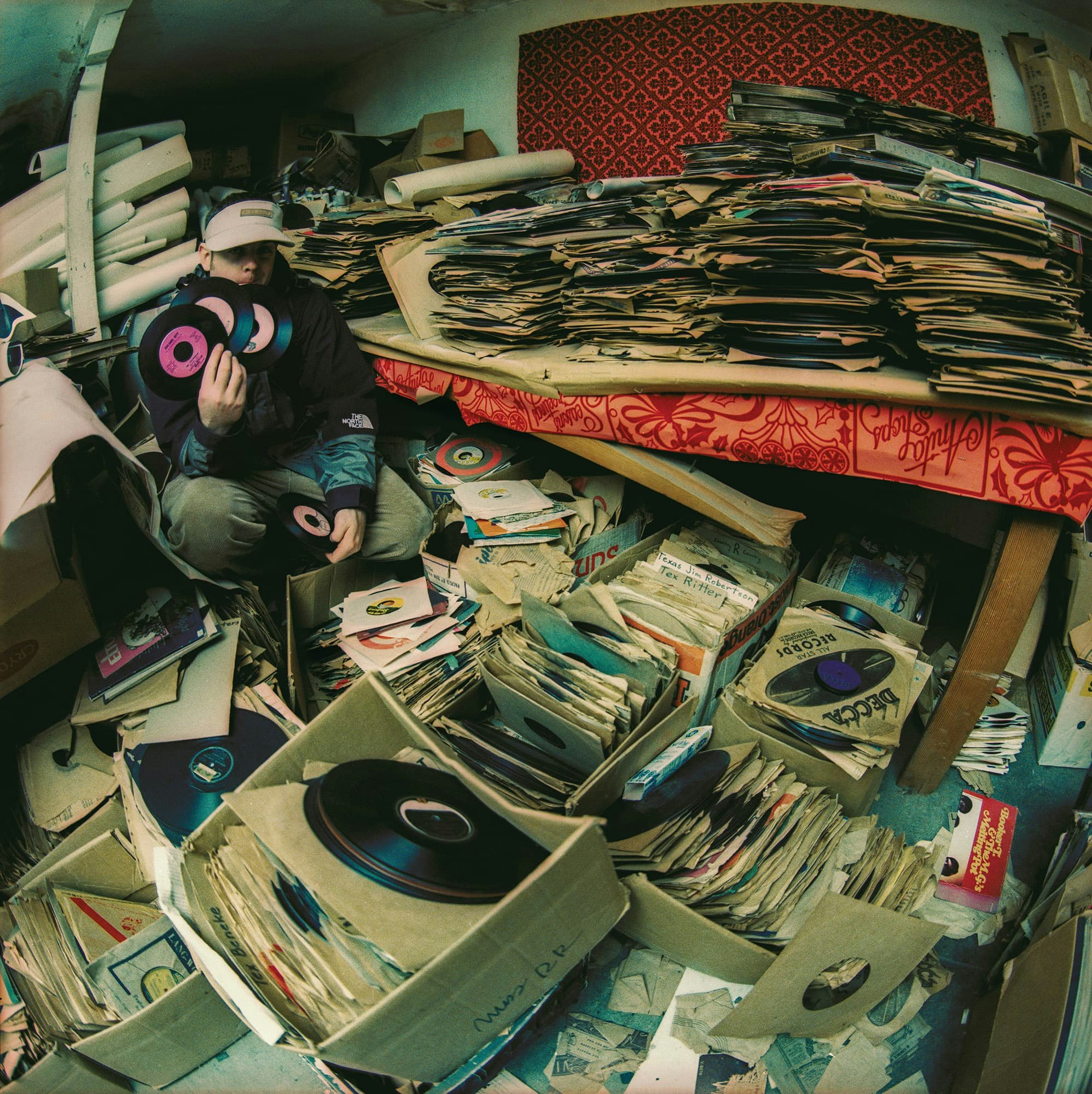 DJ Shadow exploring the basement of Records record store in Sacramento, 1995. Photo by B+.
